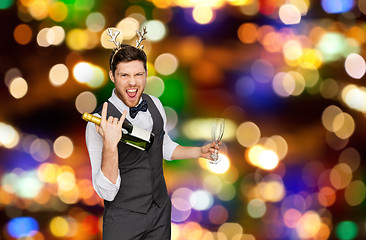 Image showing man with bottle of champagne at christmas party