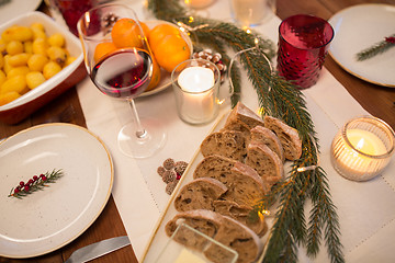 Image showing bread slices and other food on christmas table