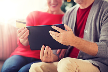 Image showing senior couple with tablet pc shopping online