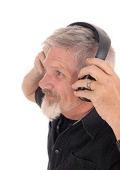 Image showing Middle age man listening to music