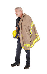 Image showing A firefighter standing in profile 