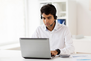 Image showing businessman with headset and laptop at office