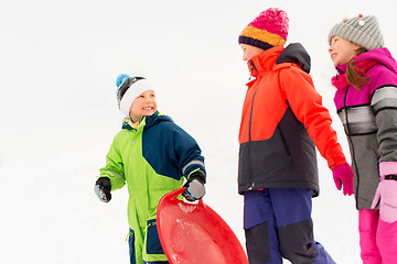 Image showing happy little kids with sleds in winter