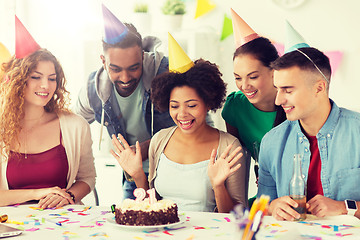 Image showing team greeting colleague at office birthday party