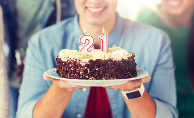 Image showing man with cake and friends at birthday party