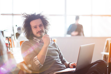 Image showing Young businessman using computer at work