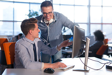 Image showing Two Business People Working With computer in office