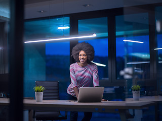 Image showing black businesswoman using a laptop in startup office