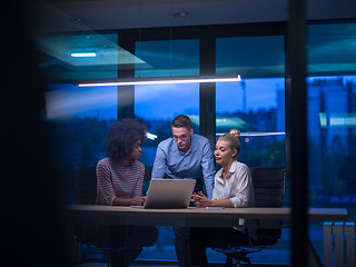 Image showing Multiethnic startup business team in night office