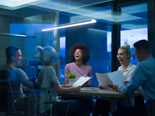 Image showing Multiethnic startup business team in night office