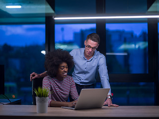 Image showing Multiethnic startup business team in night office