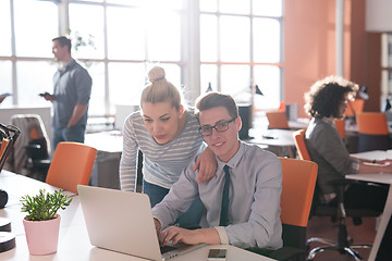 Image showing Two Business People Working With laptop in office