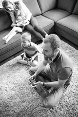 Image showing Happy family playing a video game