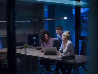 Image showing Multiethnic startup business team in night office