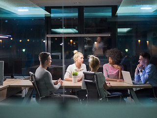 Image showing Multiethnic startup business team in night office