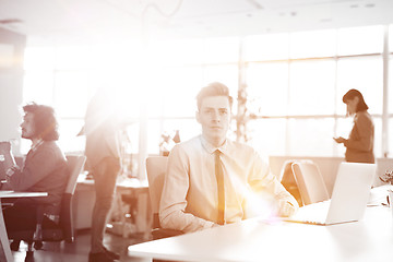 Image showing Young businessman using computer at work