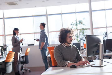 Image showing businessman working using a computer in startup office