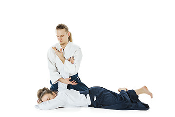 Image showing Man and woman fighting at Aikido training in martial arts school