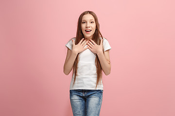 Image showing Beautiful teen girl looking suprised isolated on pink