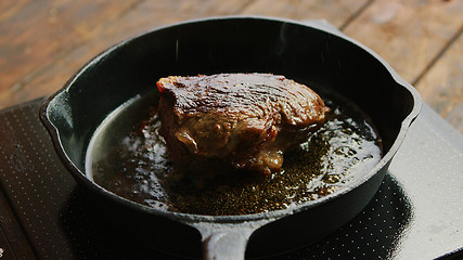 Image showing Skillet with fried meat on stove