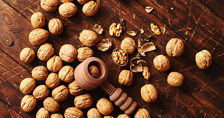 Image showing Nutcracker and nuts lying on table