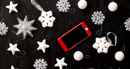Image showing Christmas decorations and smartphone