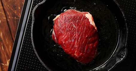 Image showing Big piece of meat on pan