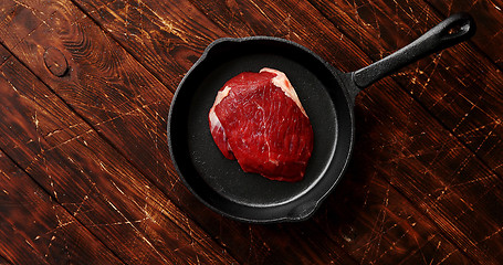 Image showing Piece of meat laid on pan