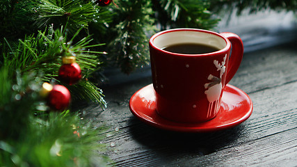 Image showing Hot beverage near decorated conifer branches