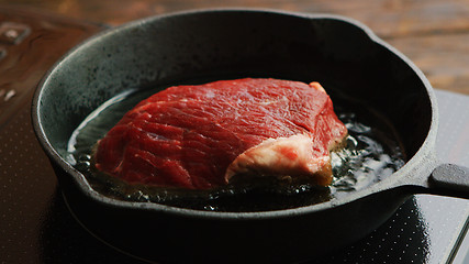 Image showing Meat frying on pan