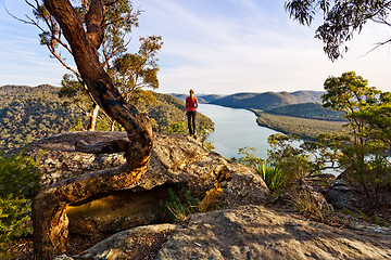 Image showing Admiring the scenic river views high from a rocky cliff ledge