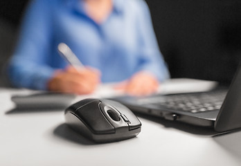 Image showing computer mouse on table at night office