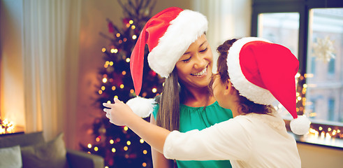 Image showing happy mother and daughter on christmas