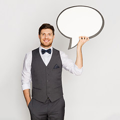 Image showing happy man in suit holding blank text bubble banner