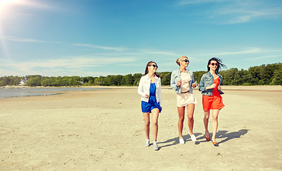 Image showing group of smiling women in sunglasses on beach