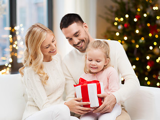 Image showing happy family at home with christmas gift