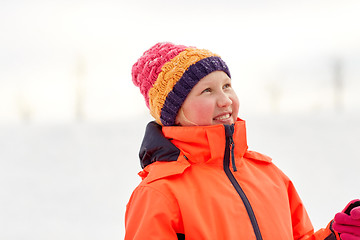 Image showing happy little girl in winter clothes outdoors