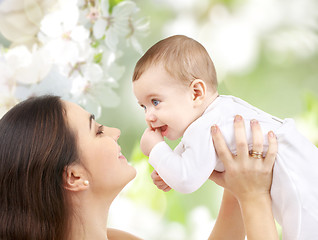 Image showing mother with baby over cherry blossom background