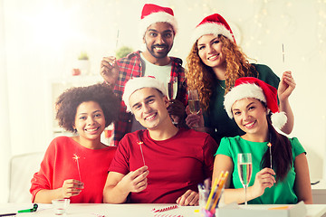 Image showing happy team celebrating christmas at office party