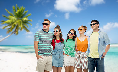 Image showing friends in sunglasses over tropical beach