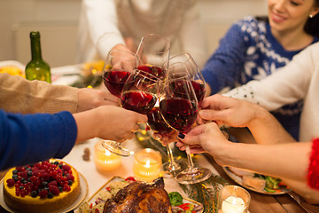 Image showing close up of friends with wine celebrate christmas
