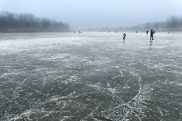 Image showing Skating on frozen lake