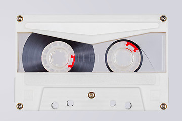 Image showing Retro white transparent audio tape isolated on white background.