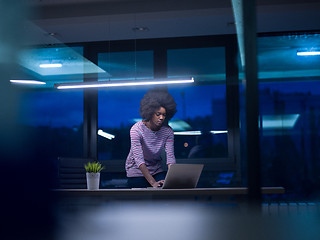 Image showing black businesswoman using a laptop in startup office