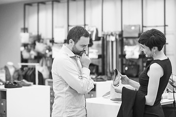 Image showing couple chooses shoes At Shoe Store