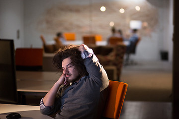 Image showing businessman relaxing at the desk