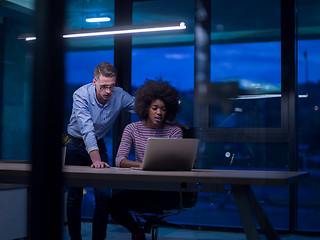 Image showing Multiethnic startup business team in night office