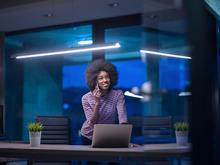 Image showing black businesswoman using a laptop in startup office