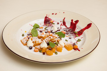 Image showing Tasty dessert from pumpkin and sea-buckthorn