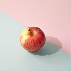 Image showing fresh apple on colored paper background